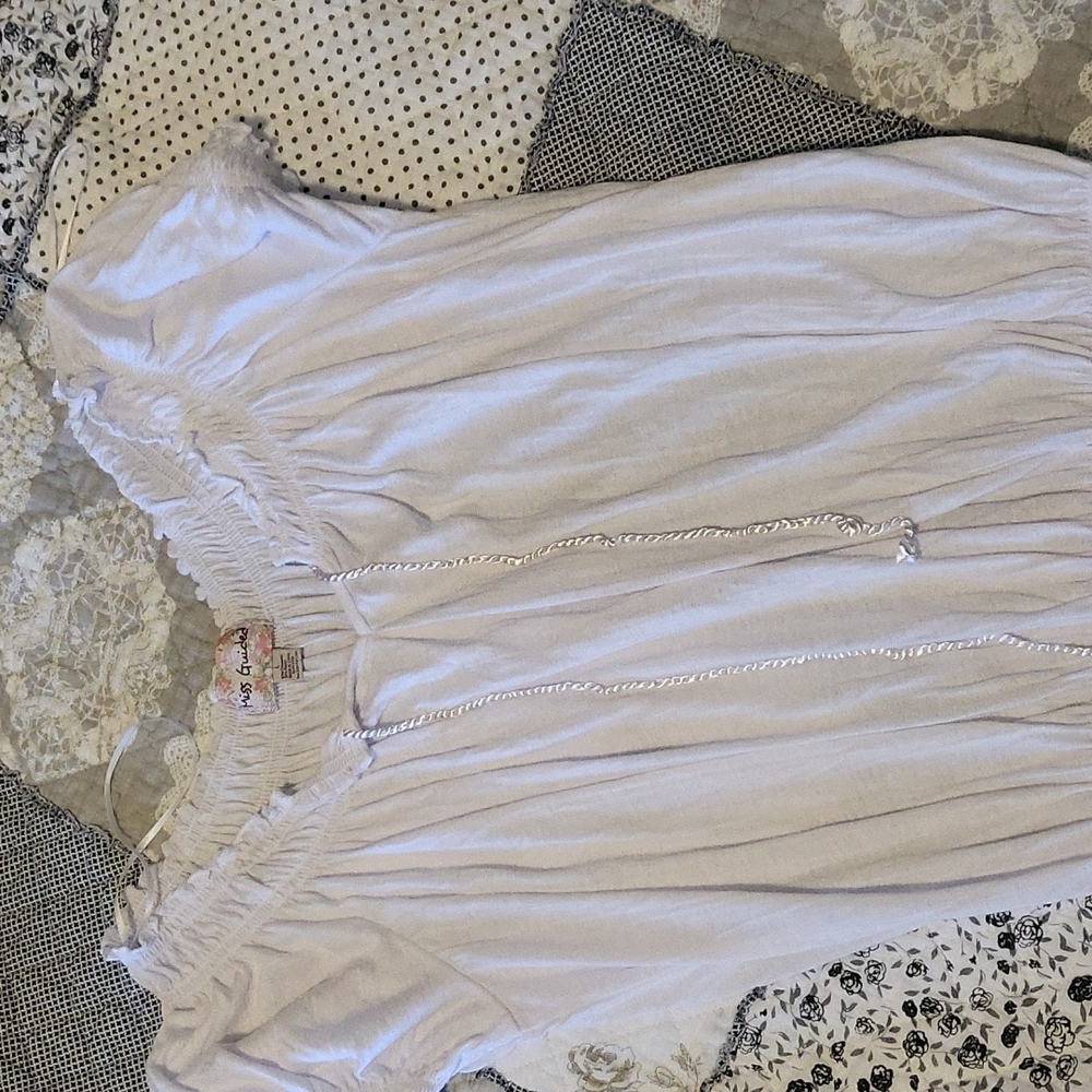Women's white short sleeve top.